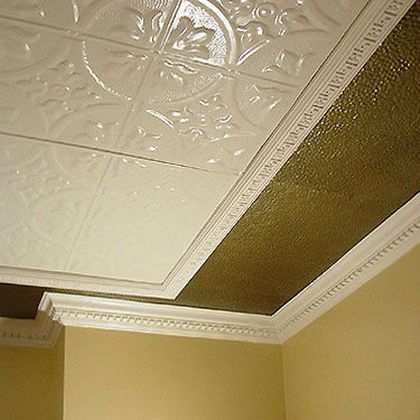 Completed tin ceiling installation with edge filler